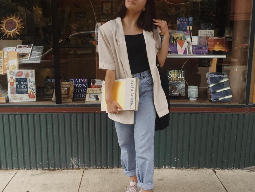 Girl standing in front of bookstore